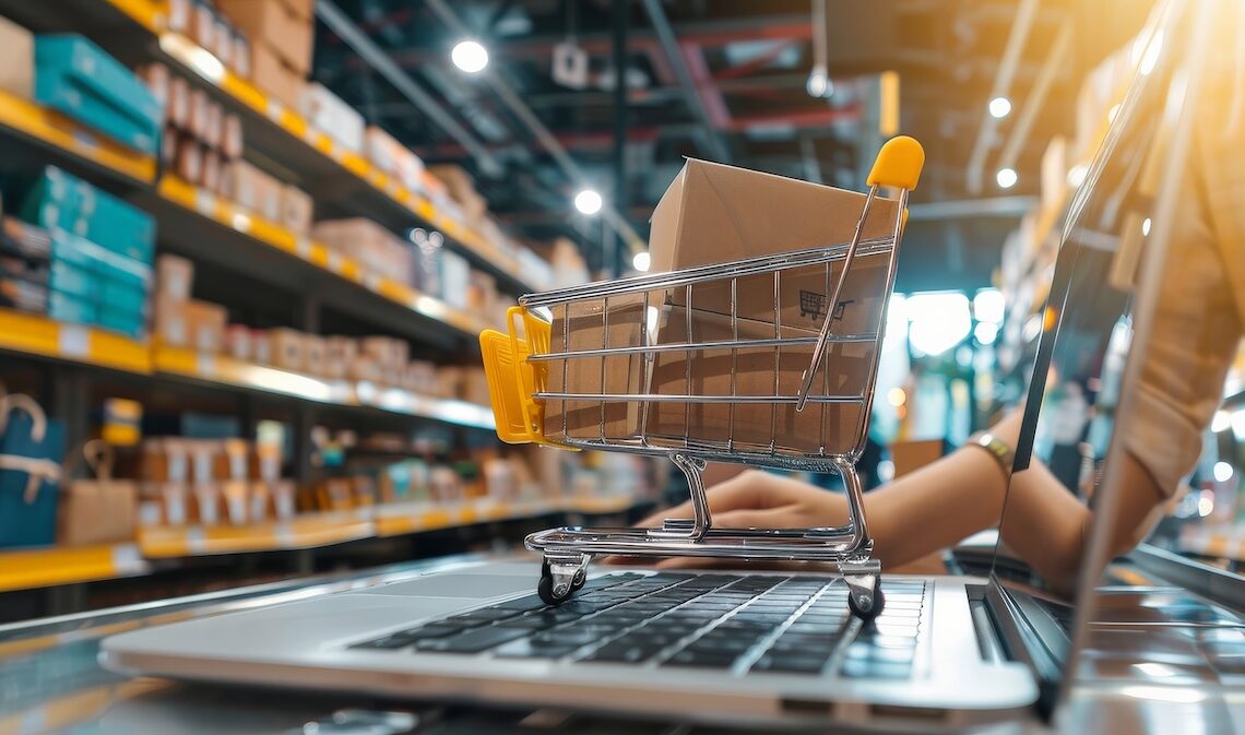 person setting up online store uploading products laptop